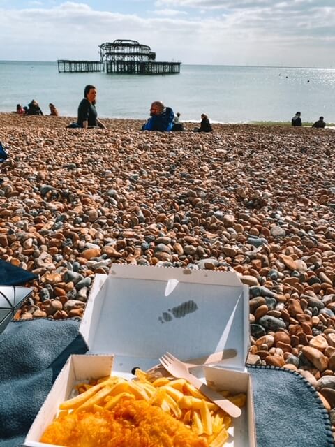 Fish and chips by the beach in Brighton - best uk day trips from london